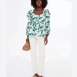 Green and White Floral Blouse with White Pants